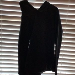A dark grey hoodie/sweatshirt